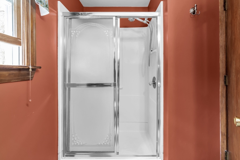 8 Portsmouth Road Amesbury, MA 01913 - Photo 31 of 37 a bathroom with a glass shower door