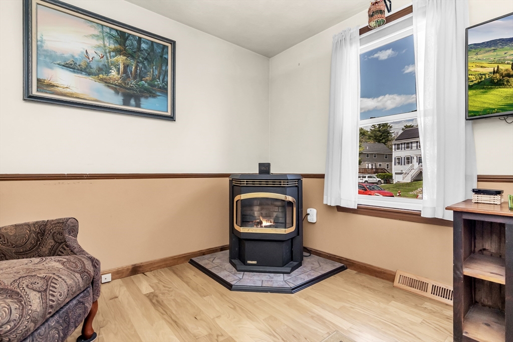 8 Portsmouth Road Amesbury, MA 01913 - Photo 5 of 37 a living room with a couch and a window