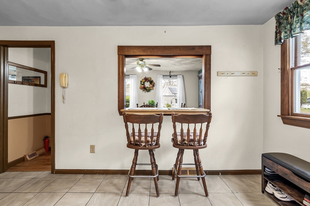 8 Portsmouth Road Amesbury, MA 01913 - Photo 10 of 37 a view of a hallway with wooden floor and glass windows