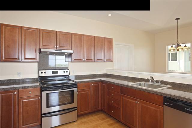 15 Maha Road, Unit 12 Makawao, HI 96768 - Photo 4 of 10 a kitchen with a sink stove and cabinets