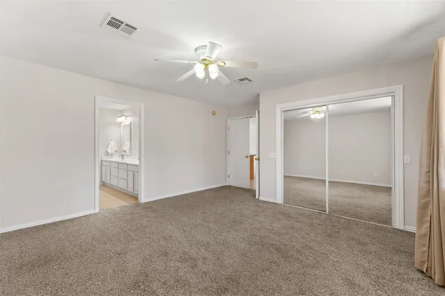 a view of an empty room with a bathroom
