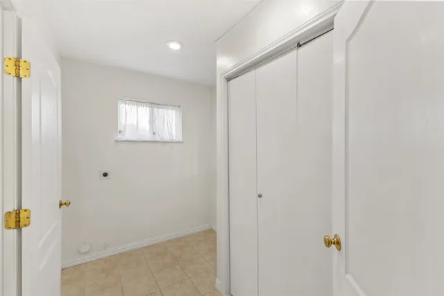 a view of a livingroom with wooden floor and closet area