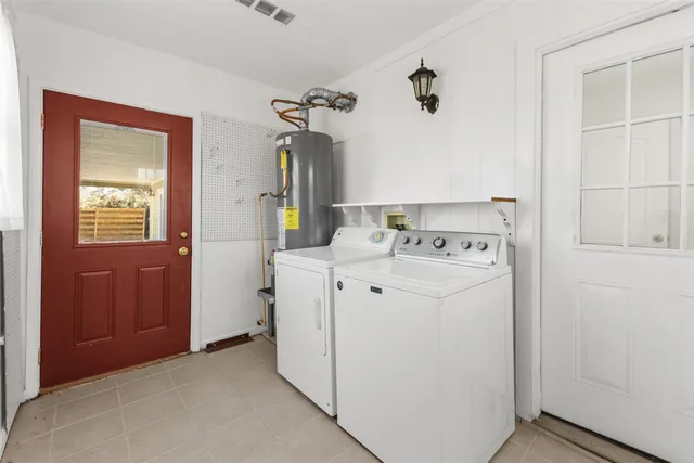 a utility room with dryer and washer