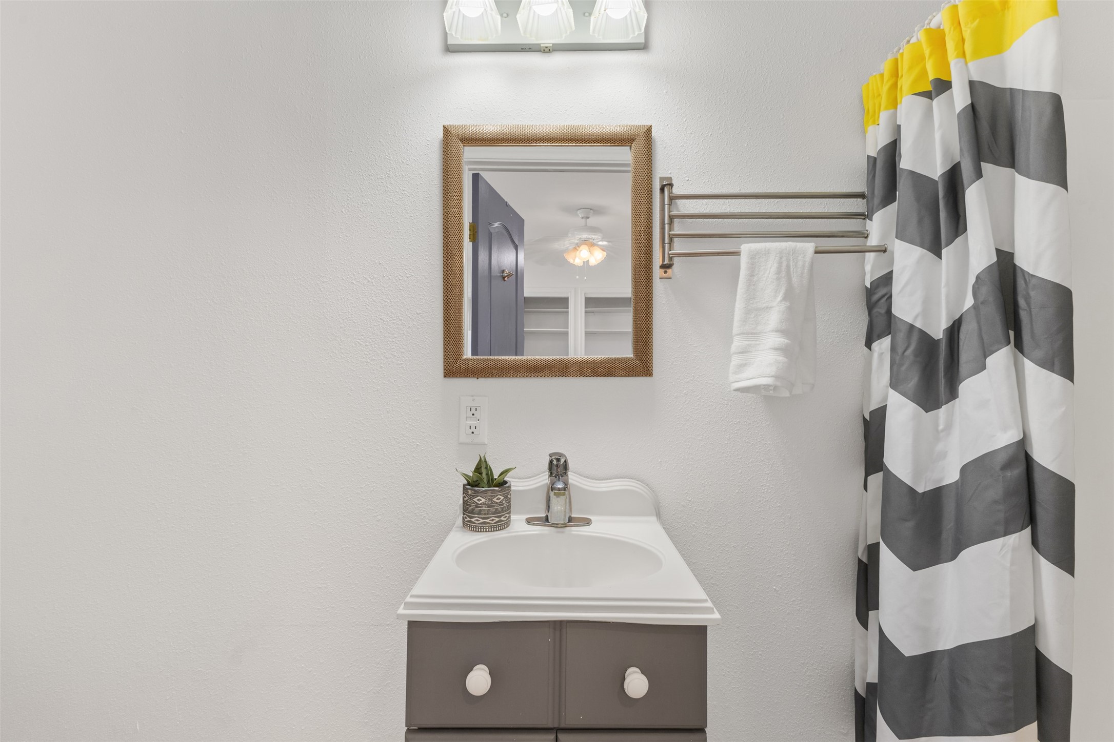 10860 County Road 272 Somerville, TX 77879 - Photo 28 of 34 a bathroom with a sink and mirror with toilet