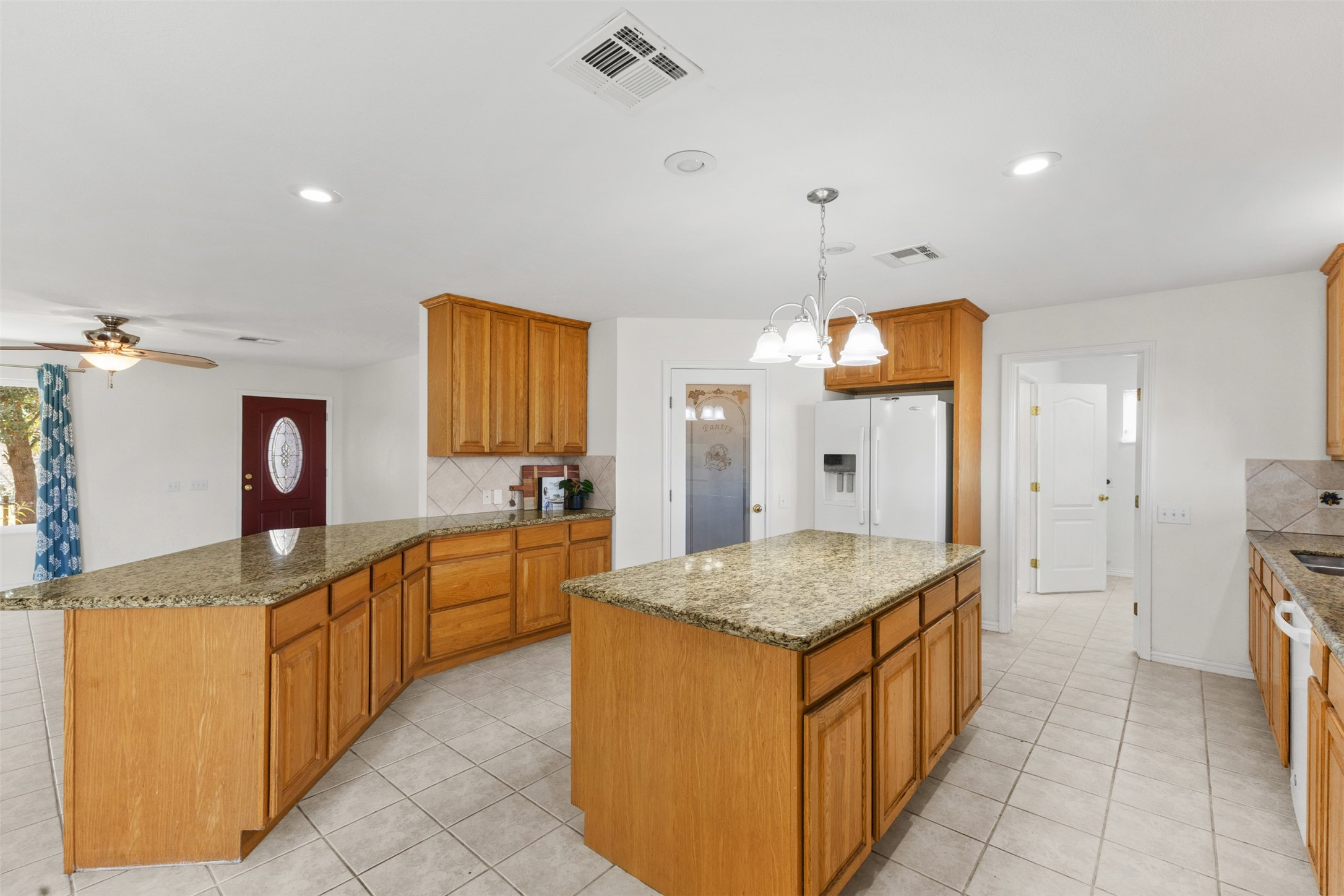 10860 County Road 272 Somerville, TX 77879 - Photo 6 of 34 a kitchen with stainless steel appliances granite countertop a sink counter space and refrigerator