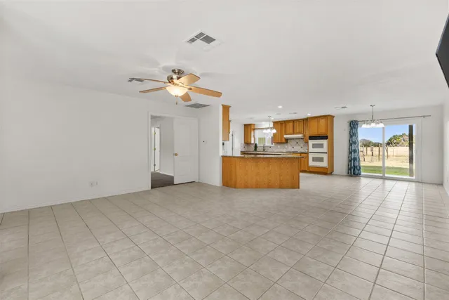 a view of a kitchen with a sink and a cabinet a fireplace