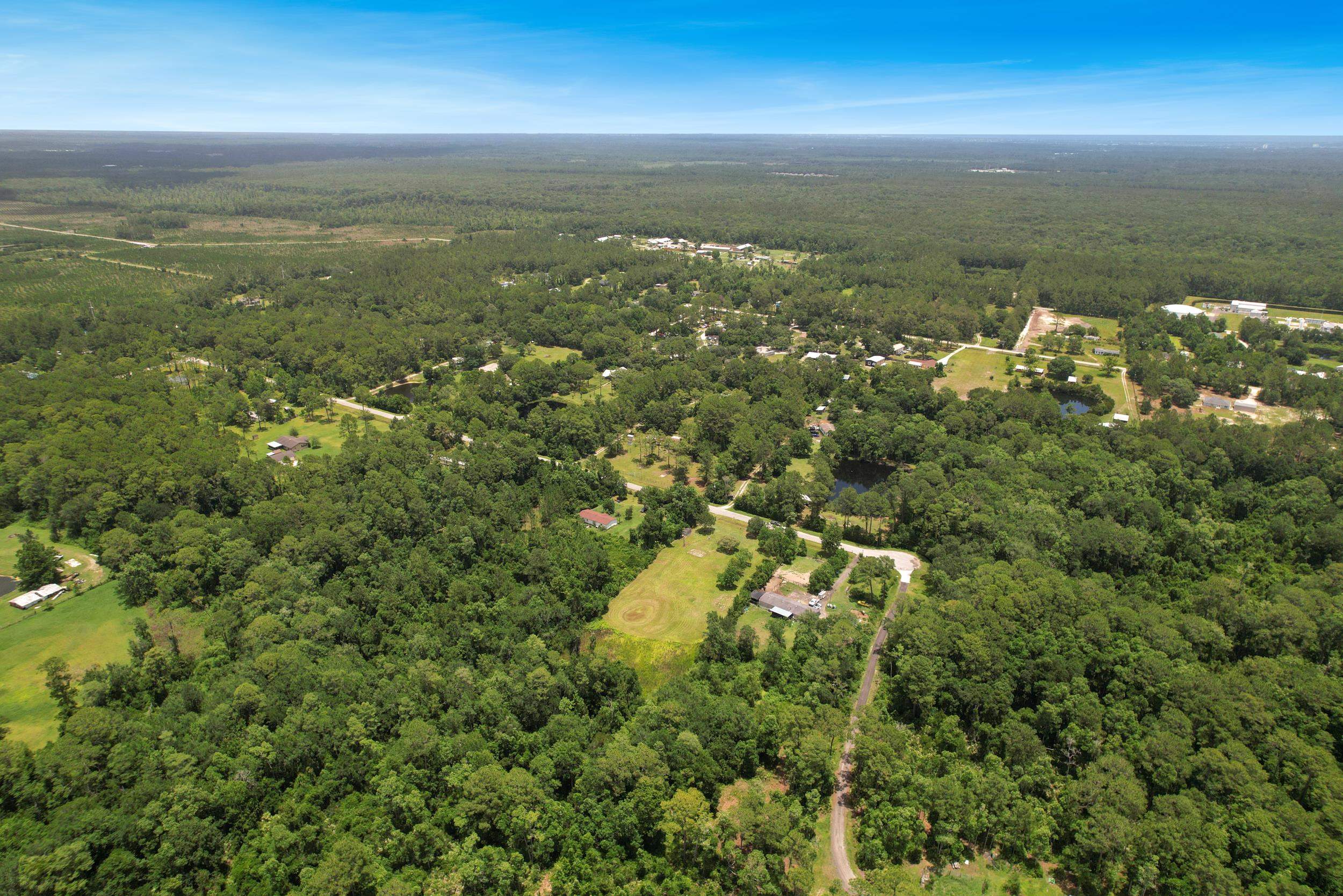 1981 Isherwood Terrace St. Augustine, FL 32092 - Photo 15 of 21 an aerial view of residential houses with outdoor space and trees
