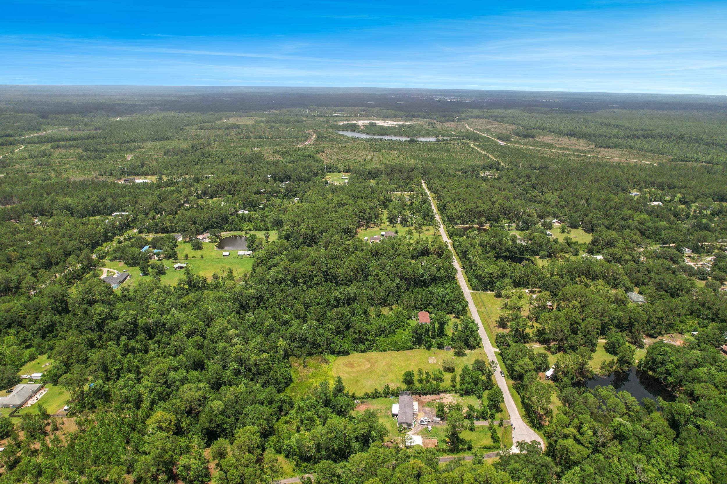 1981 Isherwood Terrace St. Augustine, FL 32092 - Photo 16 of 21 an aerial view of residential houses with outdoor space and trees