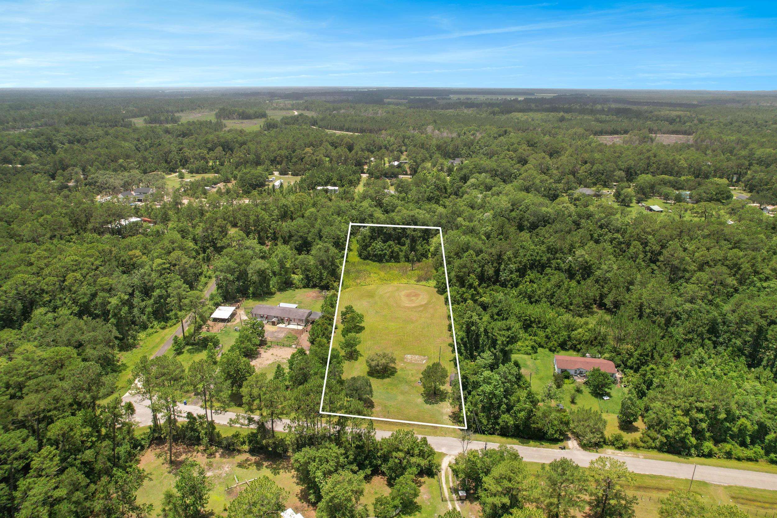 1981 Isherwood Terrace St. Augustine, FL 32092 - Photo 18 of 21 an aerial view of residential houses with outdoor space and trees