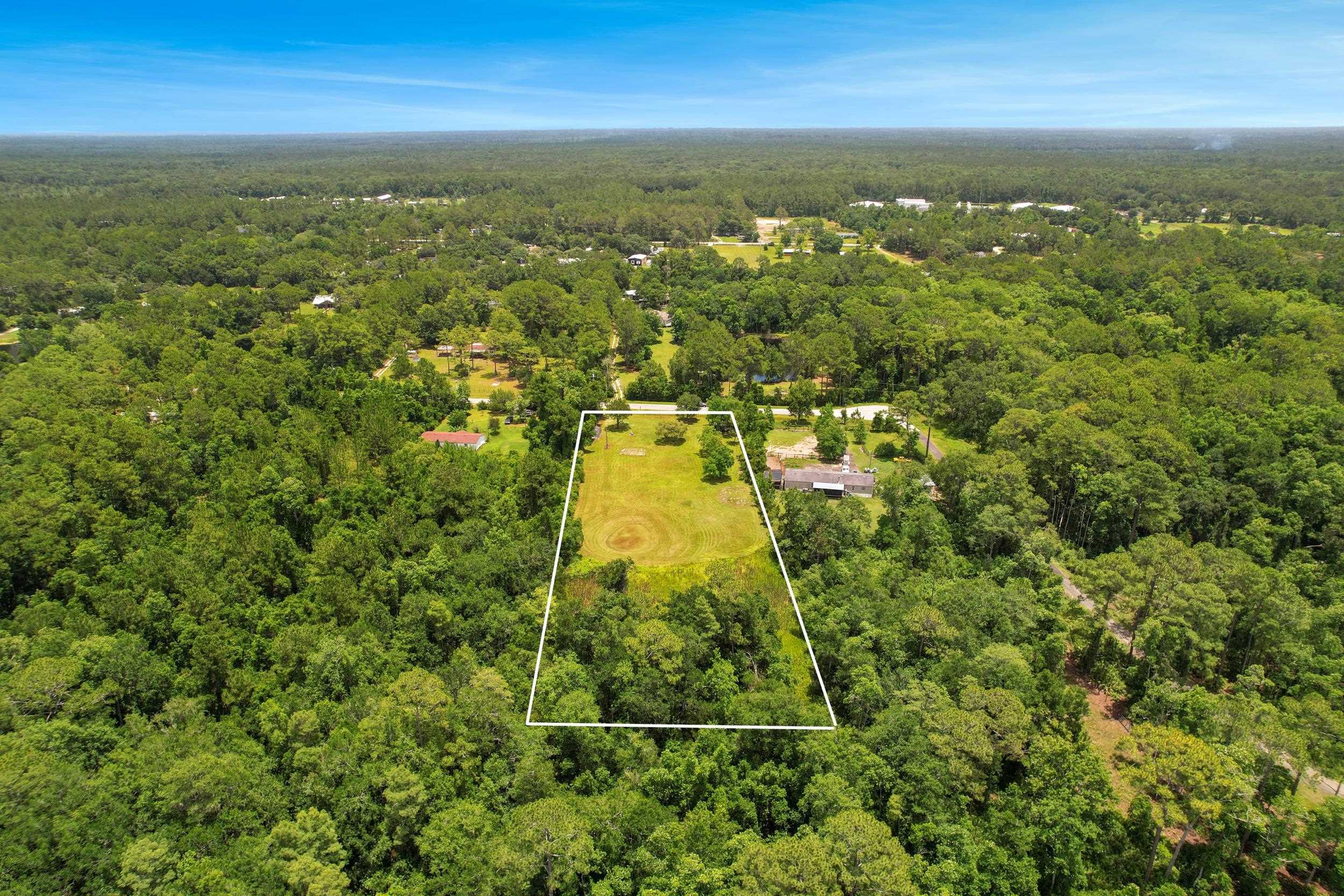 1981 Isherwood Terrace St. Augustine, FL 32092 - Photo 20 of 21 an aerial view of residential houses with outdoor space and trees