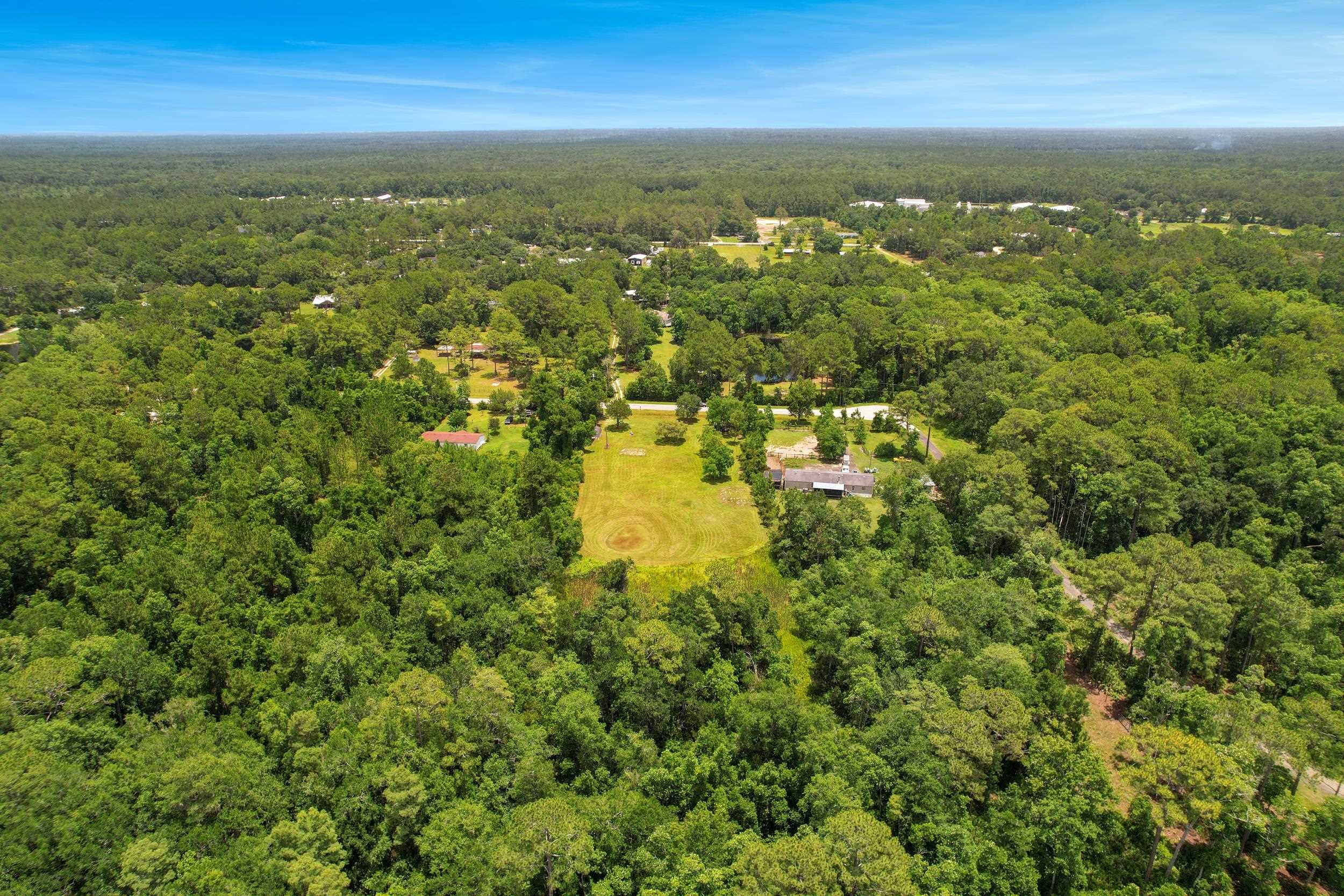 1981 Isherwood Terrace St. Augustine, FL 32092 - Photo 21 of 21 an aerial view of residential houses with outdoor space and trees