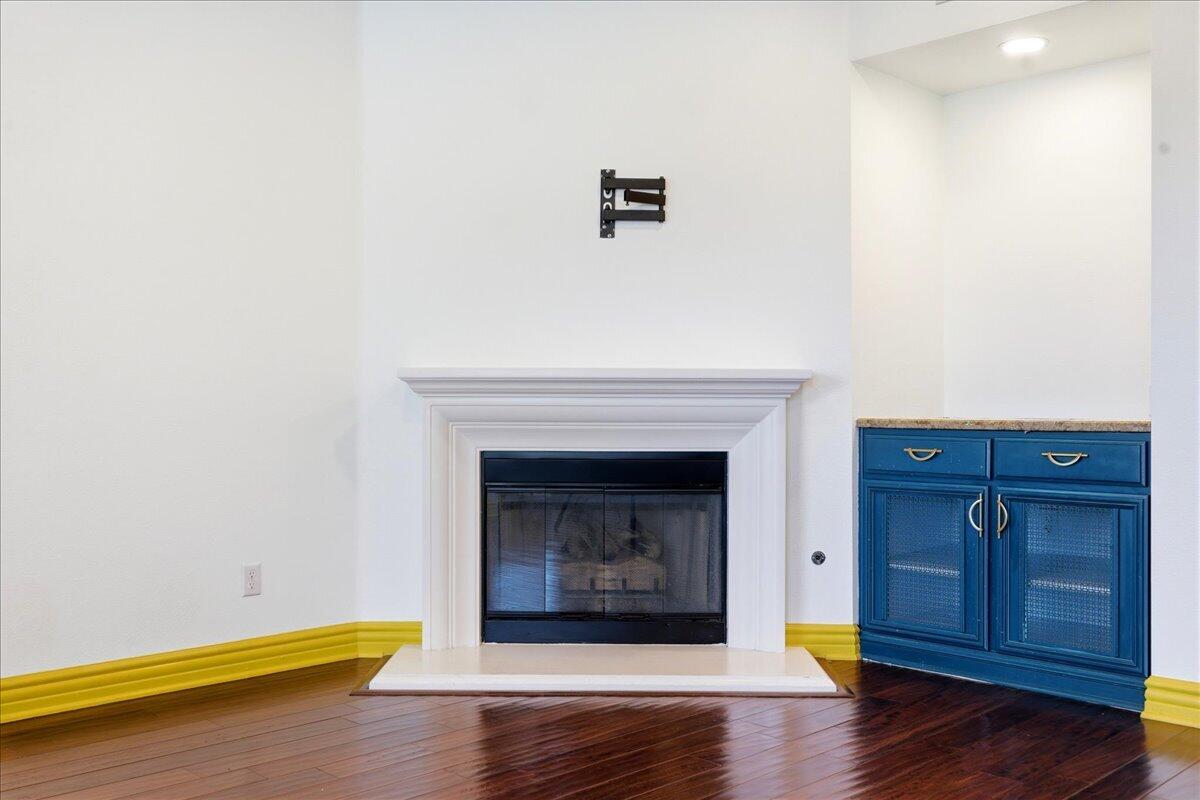 23732 Bella Vista Road Corona, CA 92883 - Photo 17 of 49 a living room with hard wood floors and a fireplace