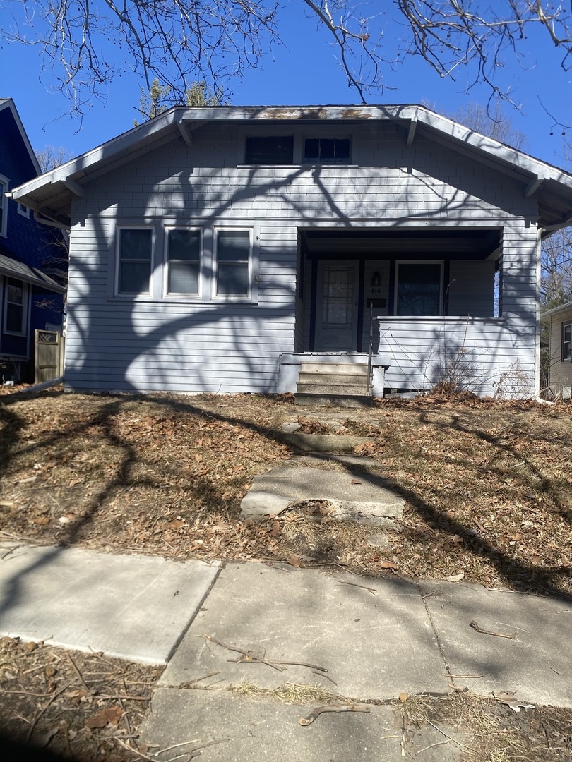 414 Hovey Avenue Normal, IL 61761 - Photo 1 of 9 a front view of a house with a garden