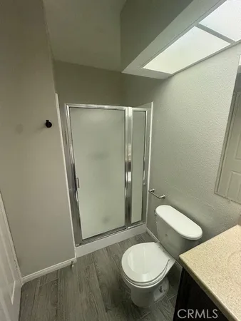 a white toilet sitting next to a bathroom sink