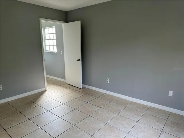 a view of an empty room and window