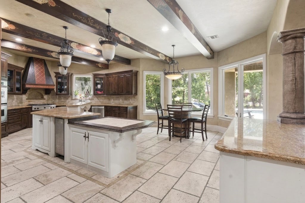 3818 Waterbend Cove Spring, TX 77386 - Photo 11 of 44 a kitchen with stainless steel appliances granite countertop a stove and a view of living room