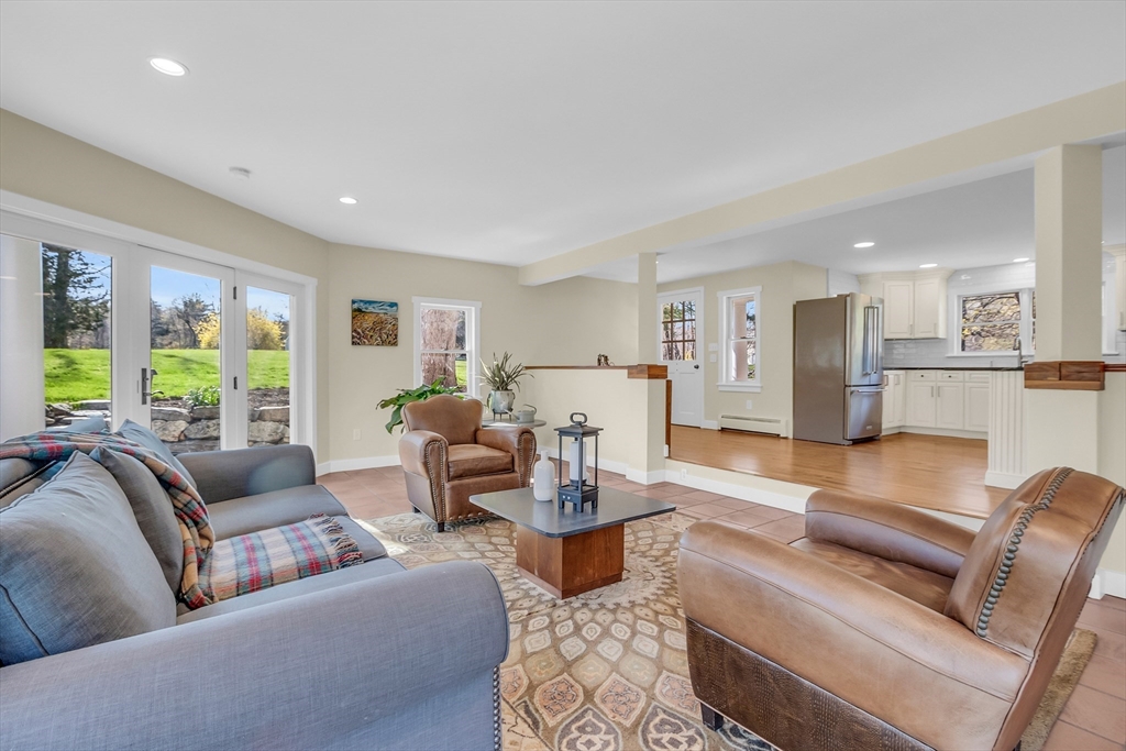 58 East End Road Bolton, MA 01740 - Photo 5 of 42 a living room with furniture wooden floor and a large window