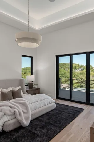 a work room with furniture and a large window