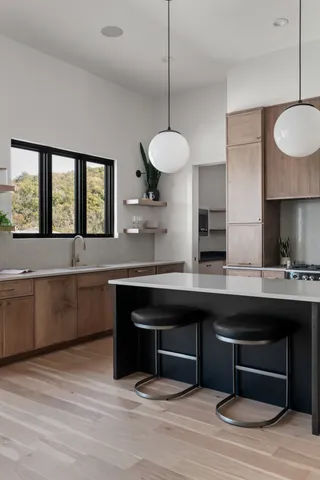 a bedroom with a large bed and a large window