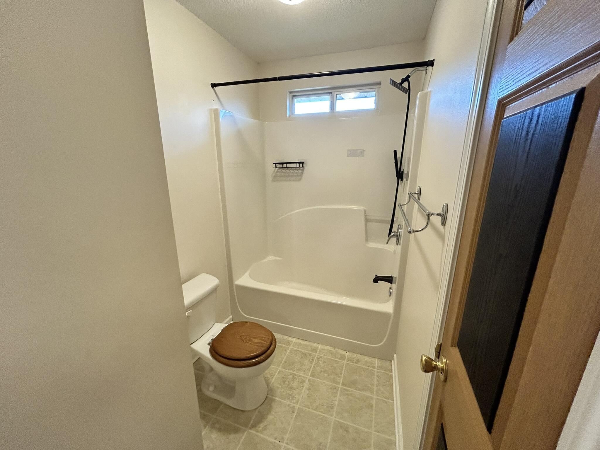 2175 Hagood Loop Crestview, FL 32536 - Photo 11 of 15 a bathroom with a shower and a toilet
