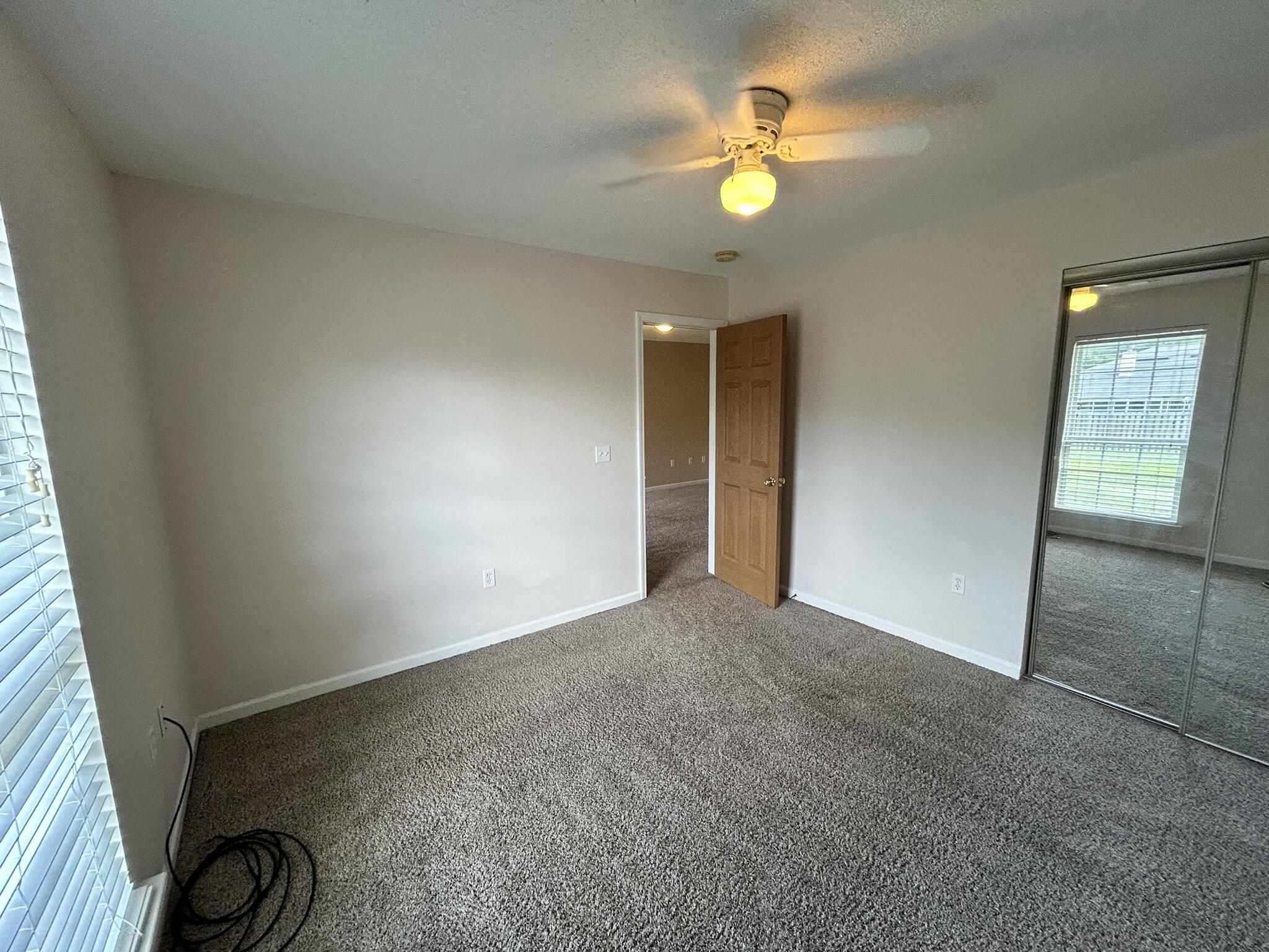 2175 Hagood Loop Crestview, FL 32536 - Photo 8 of 15 an empty room with a fan & a window