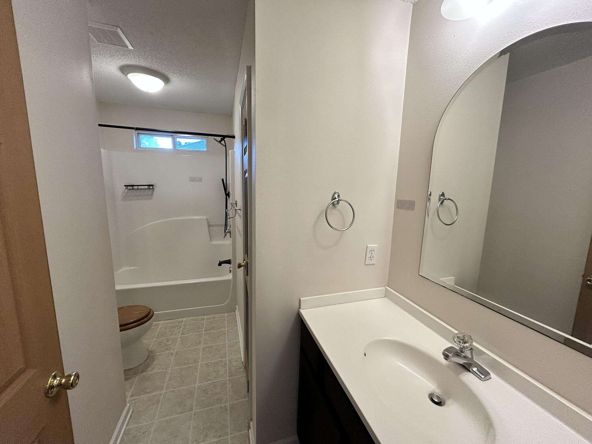 2175 Hagood Loop Crestview, FL 32536 - Photo 9 of 15 a bathroom with a sink and mirror with toilet