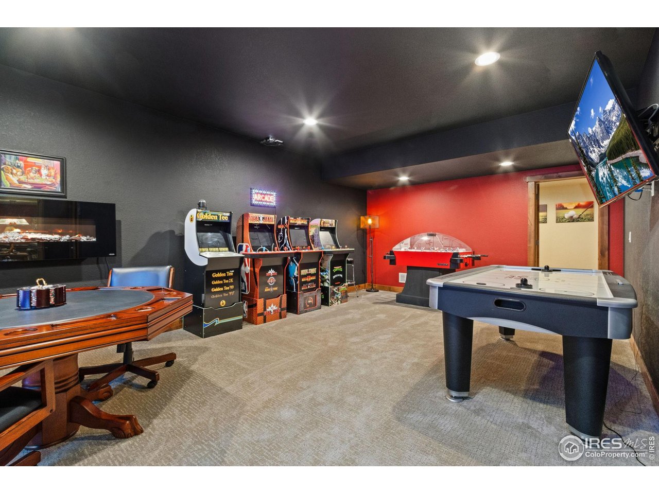 7982 Rising Sun Court Windsor, CO 80550 - Photo 31 of 48 a room with furniture and a flat screen tv