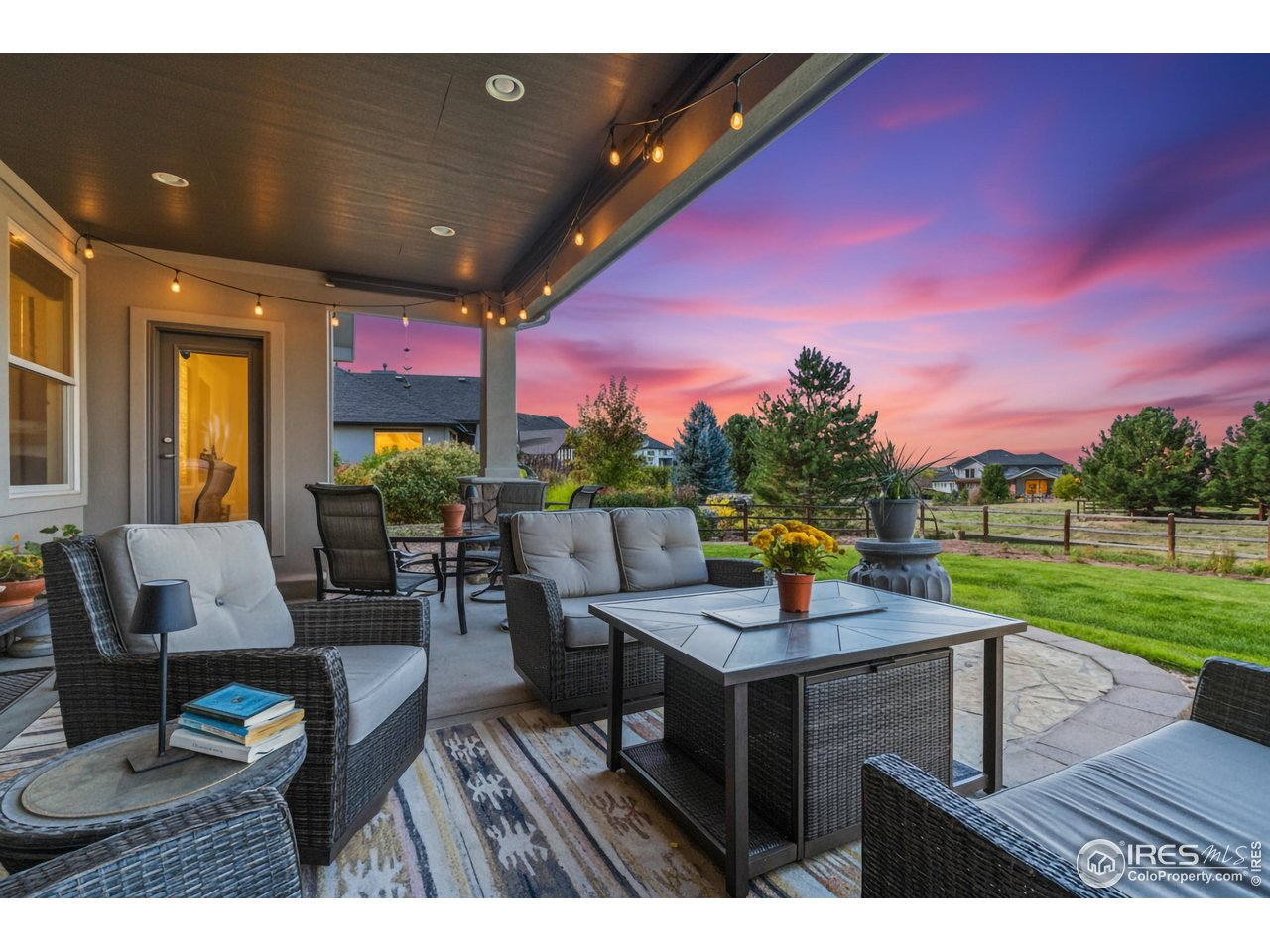 7982 Rising Sun Court Windsor, CO 80550 - Photo 35 of 48 a view of a dining room and hall with furniture