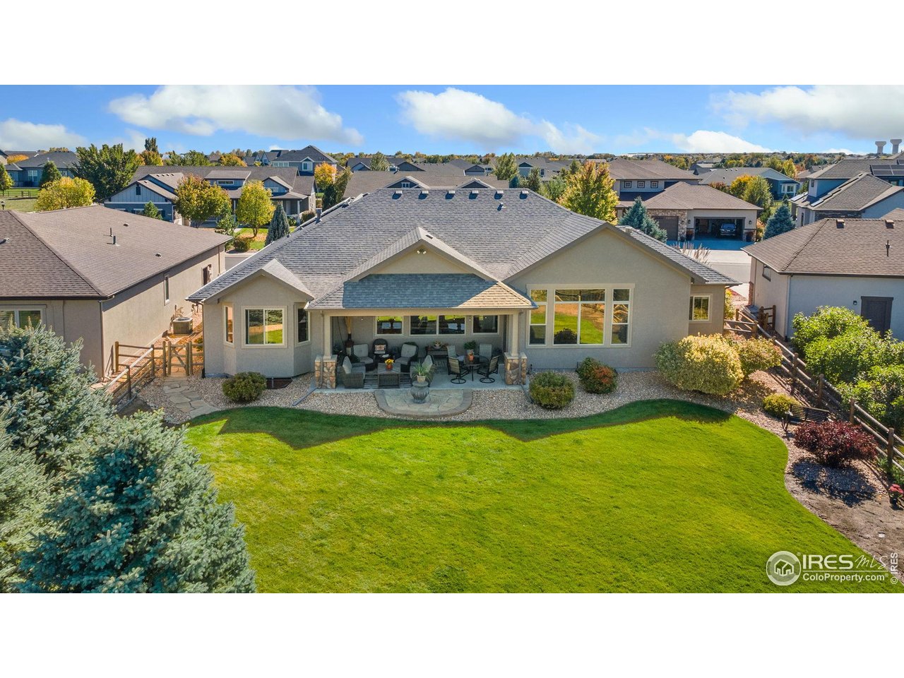 7982 Rising Sun Court Windsor, CO 80550 - Photo 42 of 48 a balcony with furniture and garden view