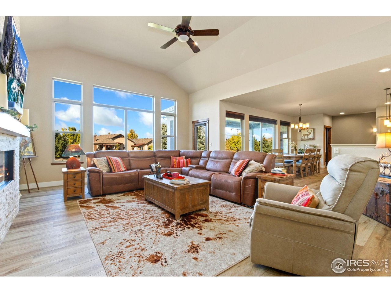 7982 Rising Sun Court Windsor, CO 80550 - Photo 7 of 48 a living room with furniture kitchen view and a large window