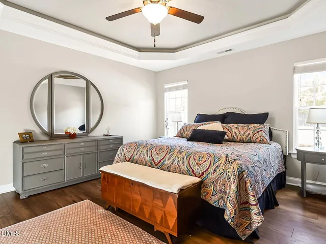 a bed room with a bed and a mirror