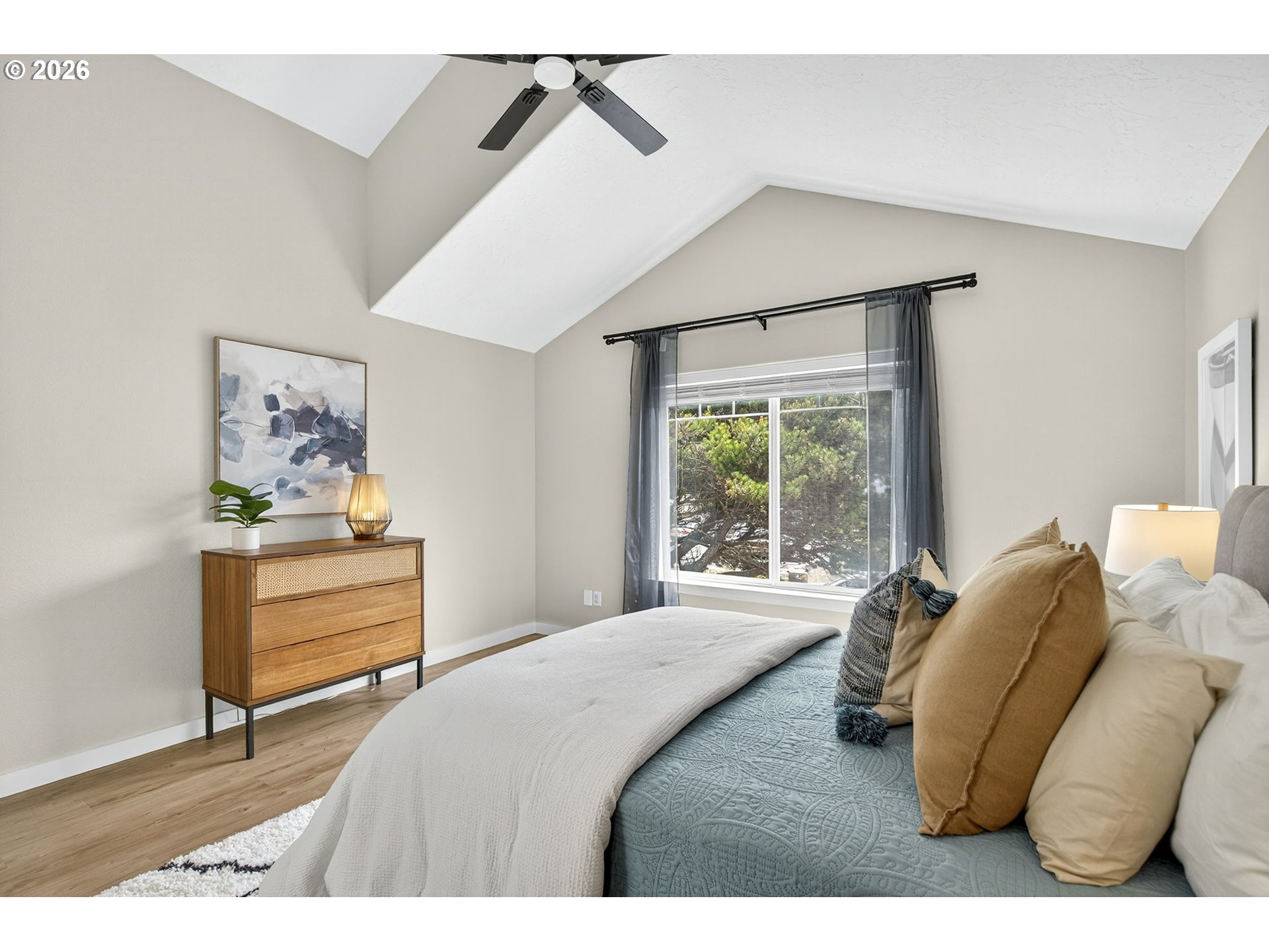 929 Northwest Spring Street Newport, OR 97365 - Photo 26 of 46 a bedroom with a bed and a window