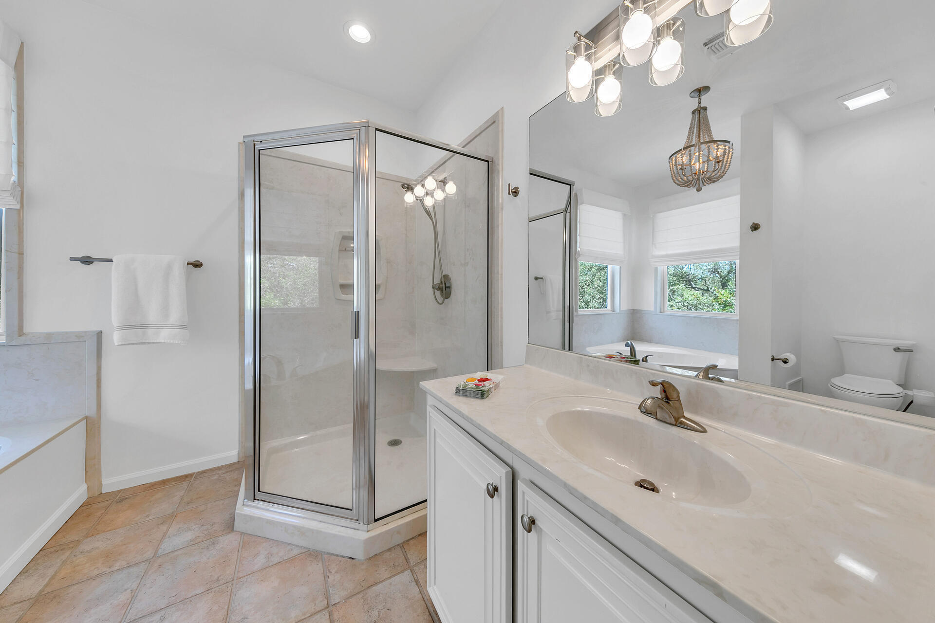 69 Lake Pointe Drive Santa Rosa Beach, FL 32459 - Photo 33 of 60 a bathroom with a shower sink vanity and mirror