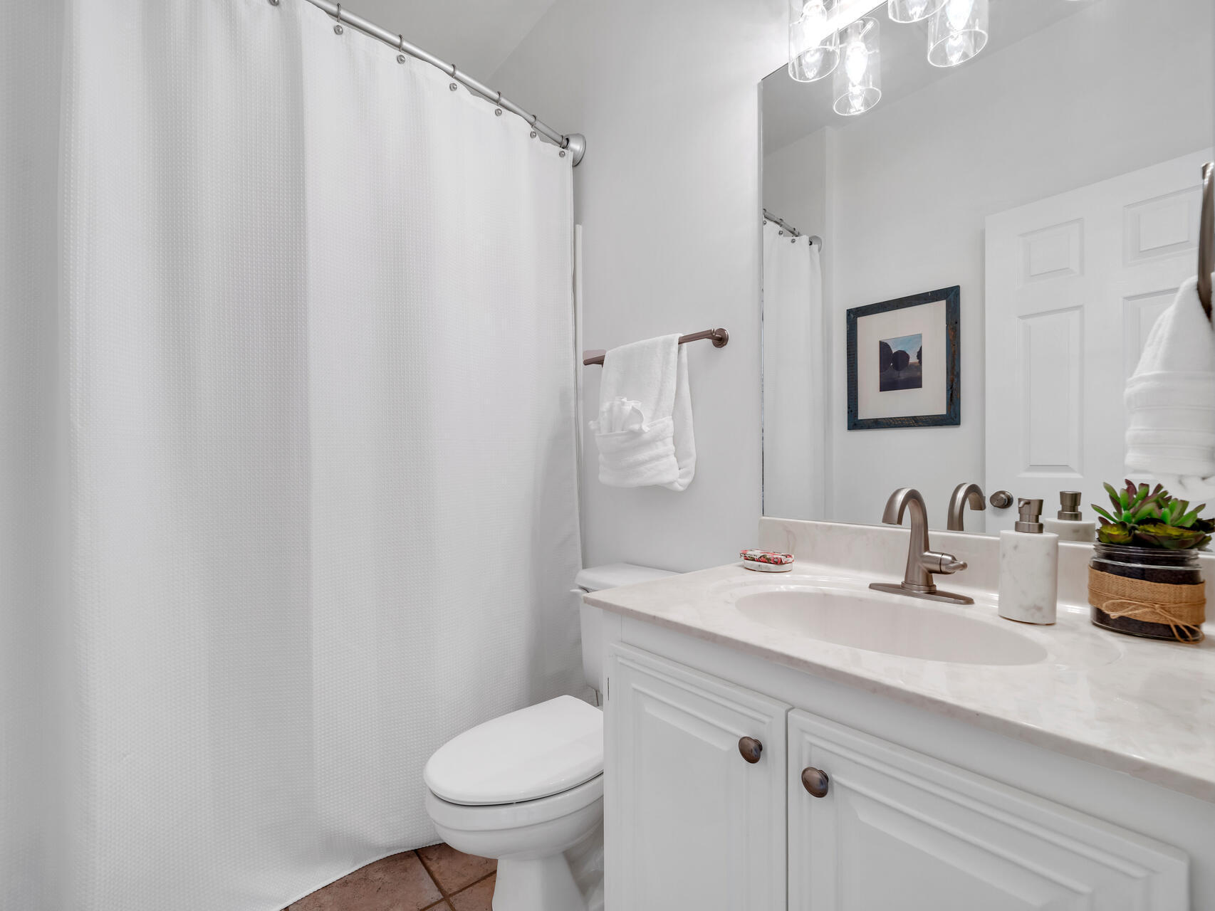 69 Lake Pointe Drive Santa Rosa Beach, FL 32459 - Photo 42 of 60 a bathroom with a sink a toilet and mirror