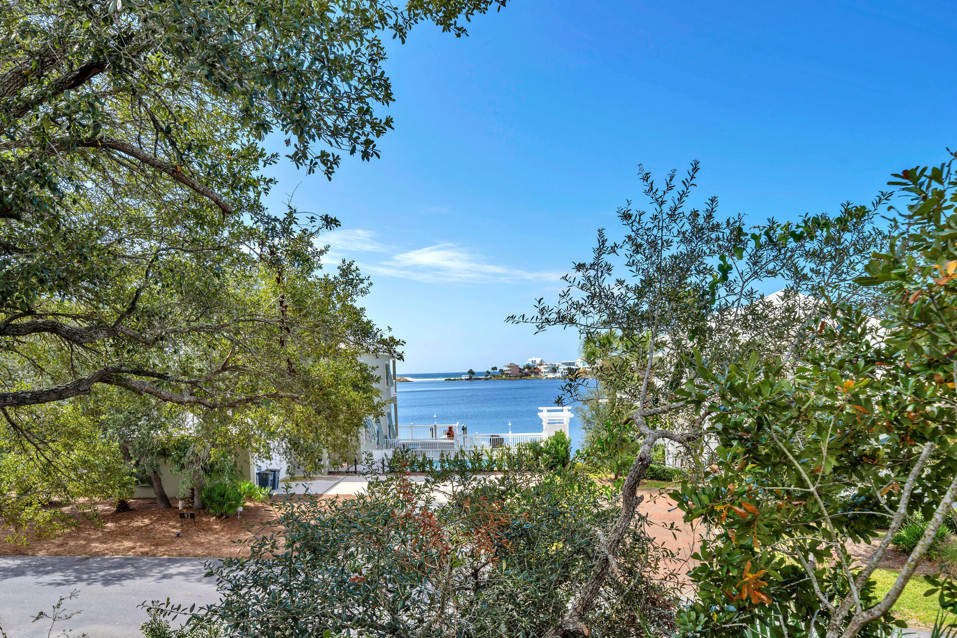 69 Lake Pointe Drive Santa Rosa Beach, FL 32459 - Photo 43 of 60 a view of a large building with a tree in the background