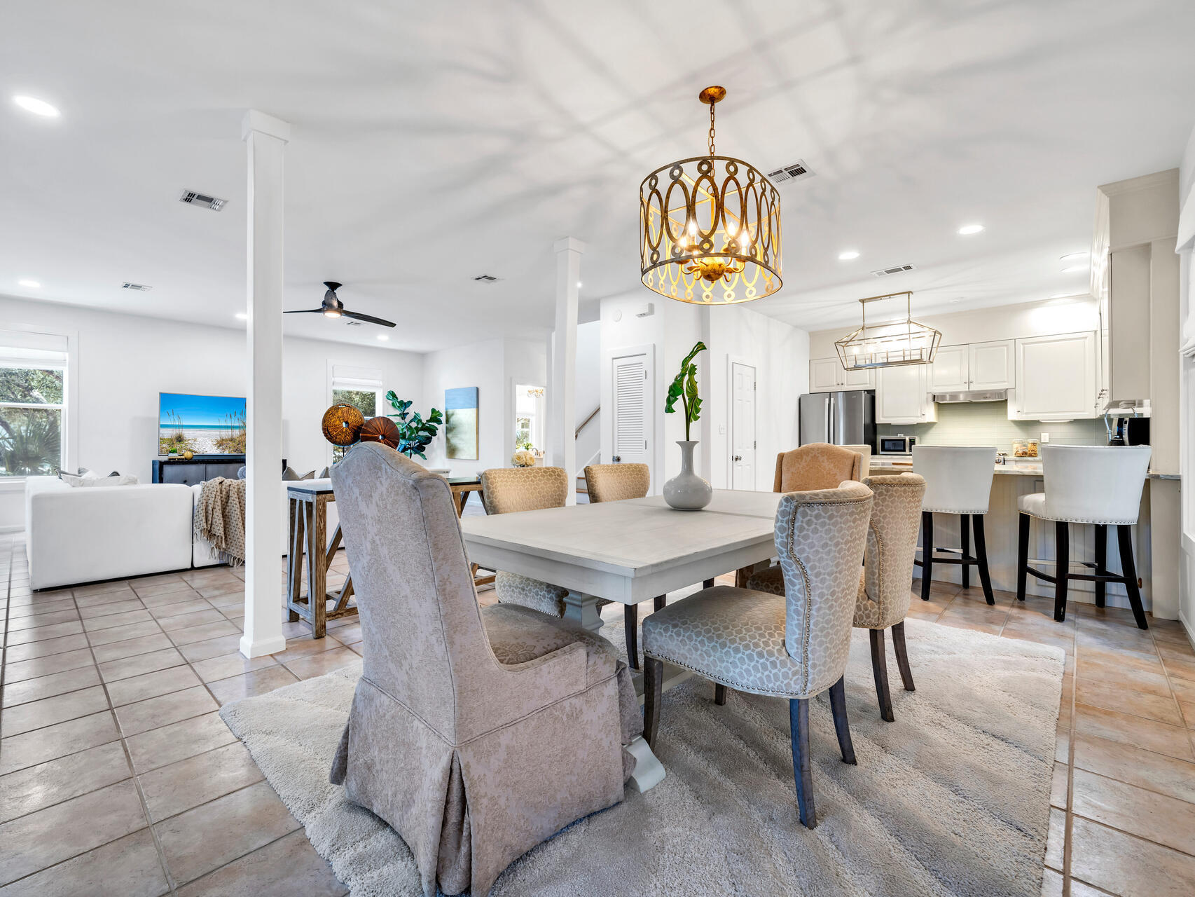 69 Lake Pointe Drive Santa Rosa Beach, FL 32459 - Photo 10 of 60 a living room with couches a dining table chairs and kitchen view
