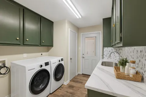 a view of a hallway with washer and dryer