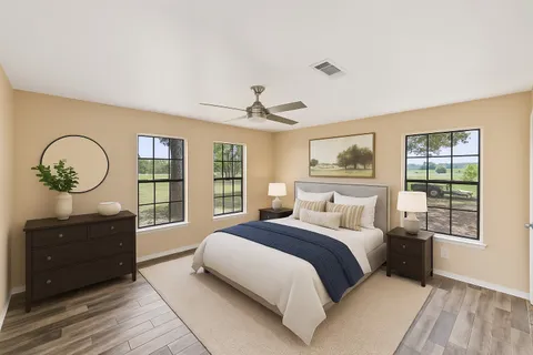 a bedroom with a large bed and a window