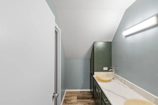 a bathroom with a sink and mirror