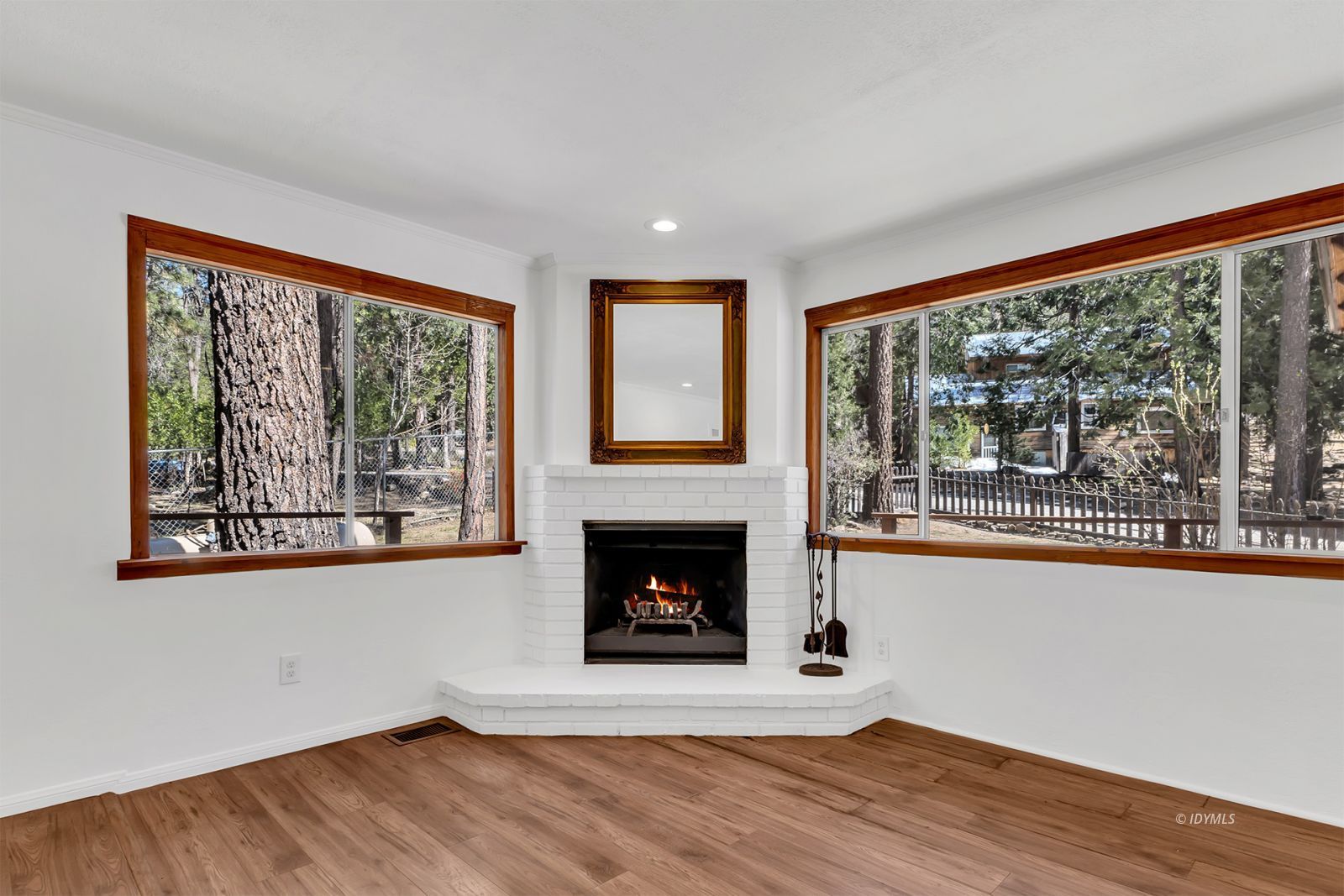 25459 Palomar Road Idyllwild, CA 92549 - Photo 14 of 51 a living room with wooden floor and a fireplace