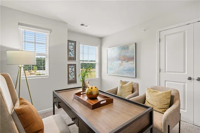 a living room with furniture and window