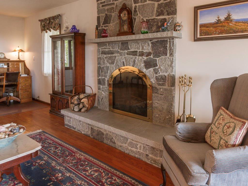 419 Pemaquid Harbor Road Pemaquid, ME 04558 - Photo 9 of 34 Beautiful stone fireplace in living room