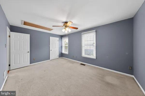 a view of an empty room with windows