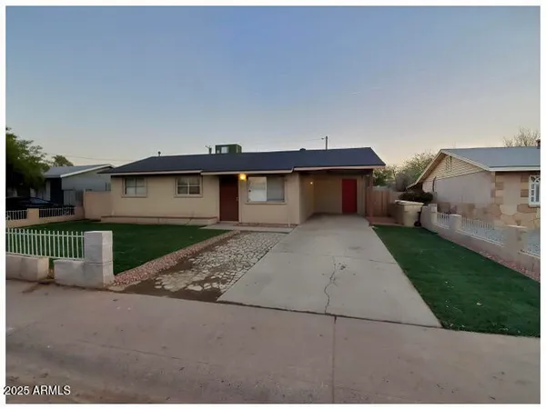 a front view of a house with garage