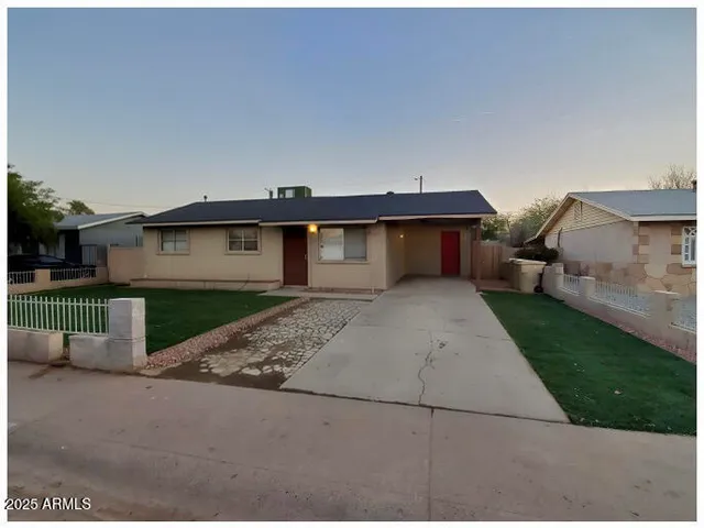 a front view of a house with garage