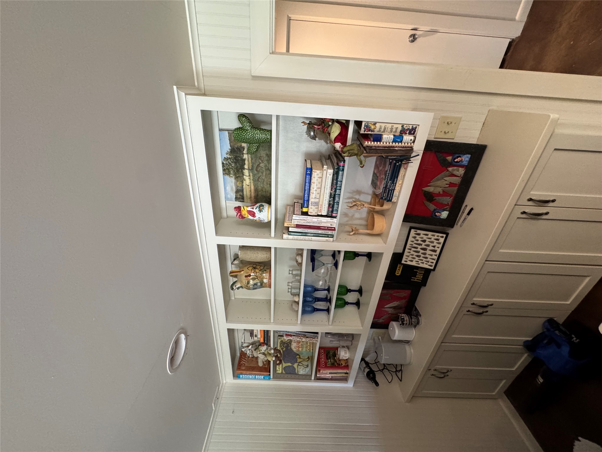 12501 Fitzhugh Road Austin, TX 78736 - Photo 18 of 40 Custom built-in shelving offers both display and concealed storage in this versatile room.