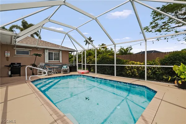 a view of a backyard with sitting area