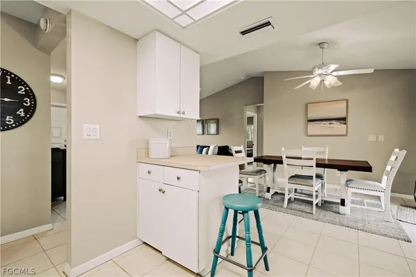 a kitchen with a sink cabinets and window