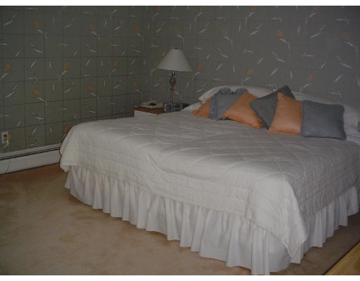122 Kendall Road Lexington, MA 02421 - Photo 11 of 15 a bedroom with a bed and a night stand