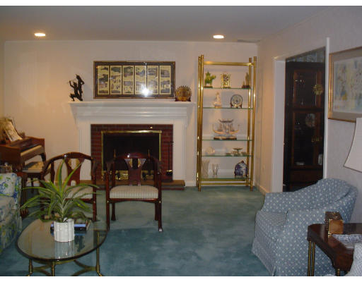 122 Kendall Road Lexington, MA 02421 - Photo 3 of 15 a living room with furniture and a fireplace